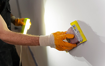 construction worker wearing protection gloves
